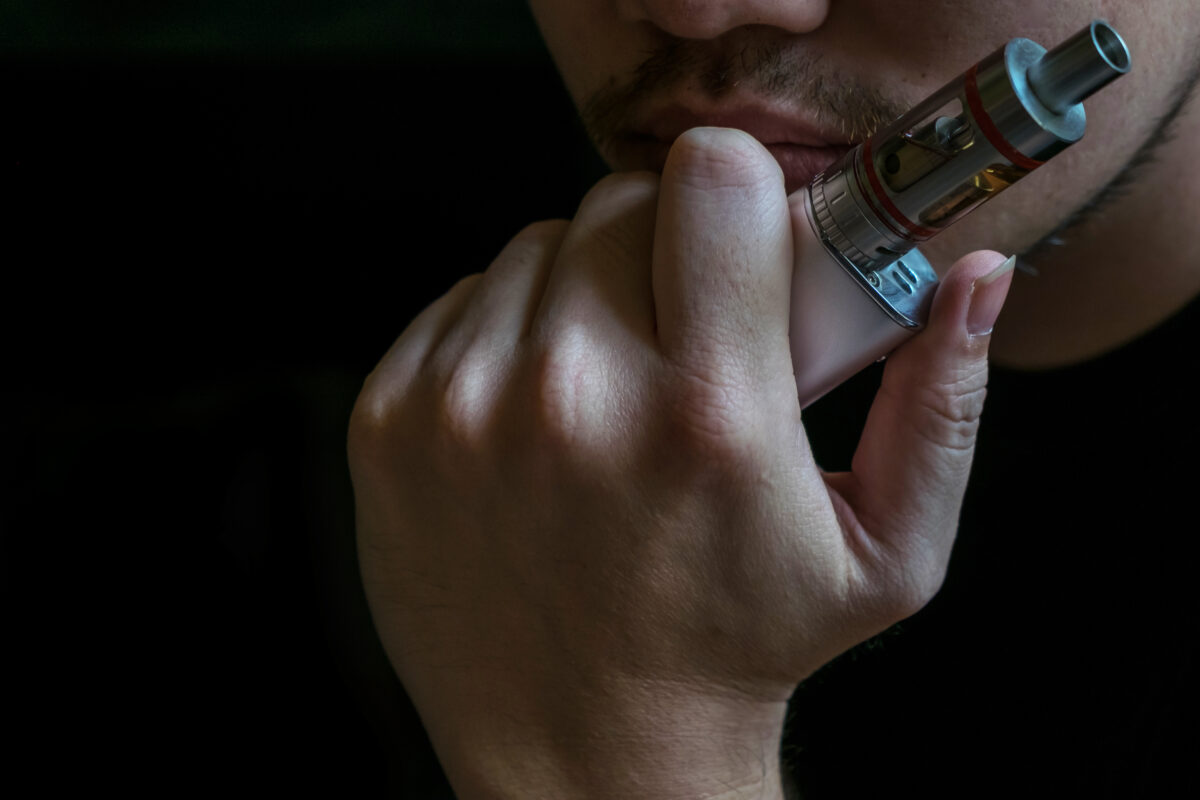 a man vaping e cigarette